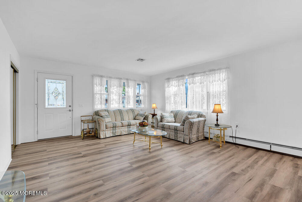 148 Davenport Road Toms River, NJ 08757 - Photo 7 of 49 a living room with furniture and a wooden floor