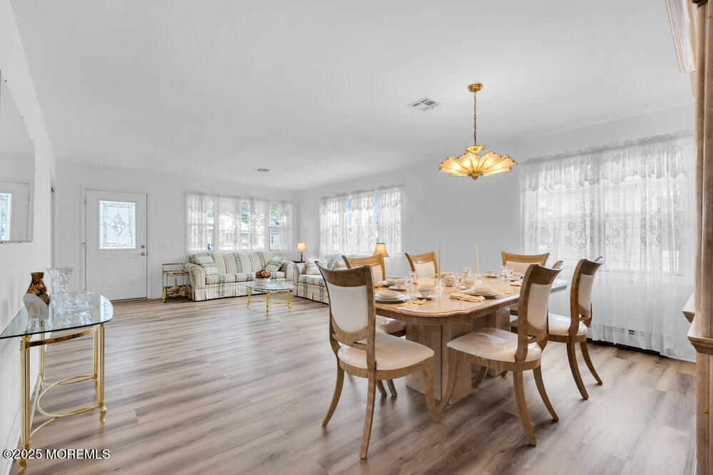 148 Davenport Road Toms River, NJ 08757 - Photo 7 of 49 a view of a dining room with furniture and wooden floor