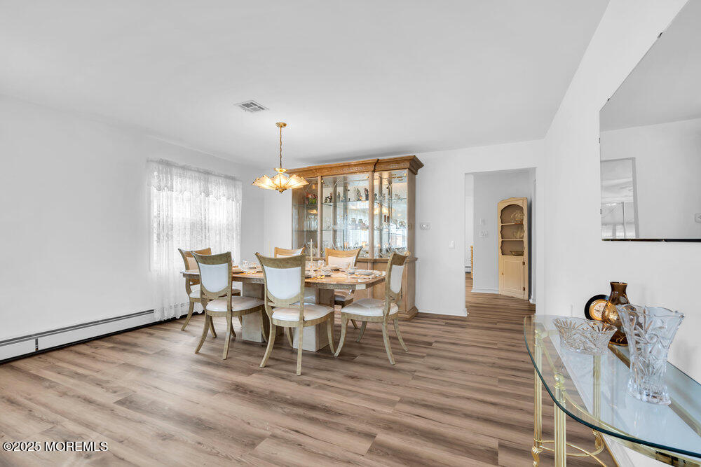 148 Davenport Road Toms River, NJ 08757 - Photo 10 of 49 a view of a dining room with furniture window and wooden floor