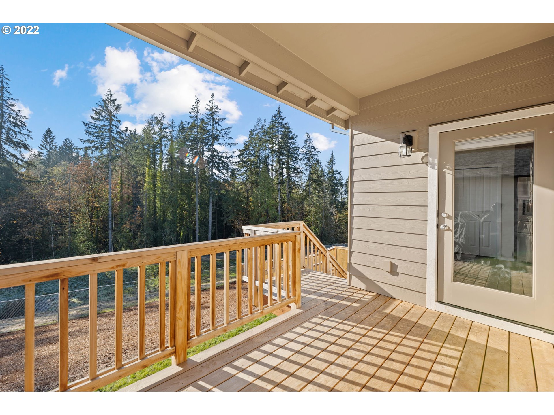 2649 South Harper Valley Way Ridgefield, WA 98642 - Photo 24 of 27 a view of a wooden deck and a yard