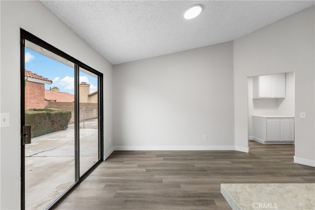 3563 East Ave R-11 Palmdale, CA 93550 - Photo 16 of 36 a view of empty room with wooden floor and fan