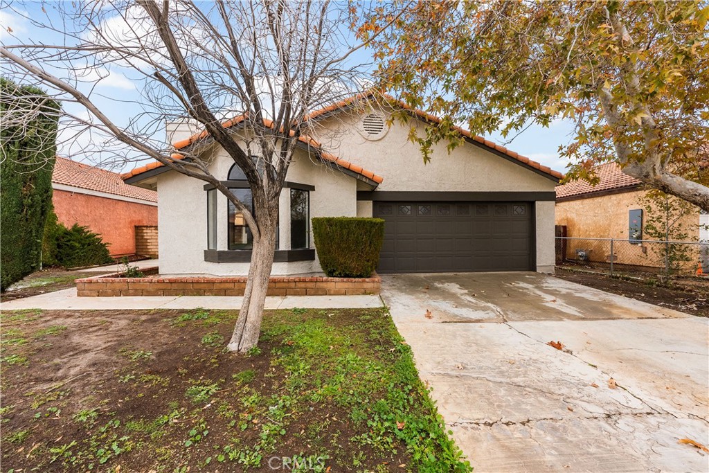 3563 East Ave R-11 Palmdale, CA 93550 - Photo 3 of 36 a front view of a house with a yard