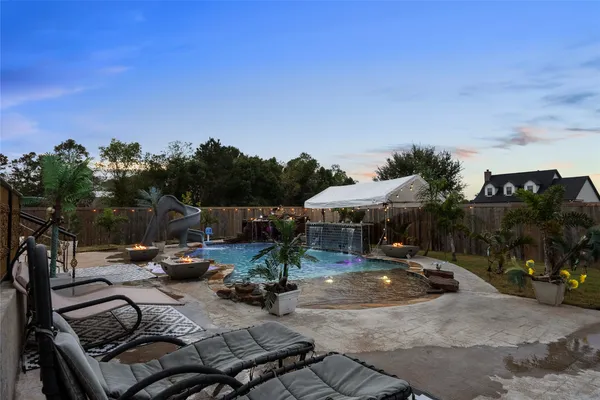 a view of a patio with swimming pool