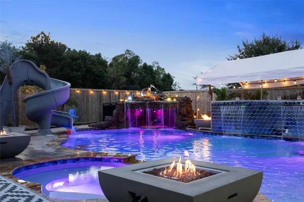 a view of swimming pool with outdoor seating
