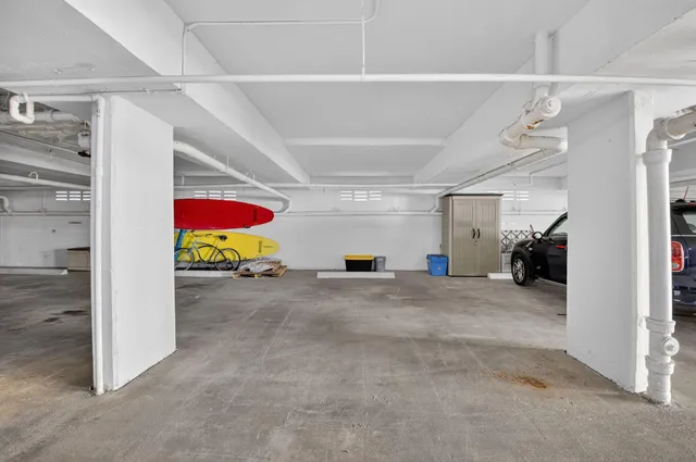 a view of a swimming pool with a patio and a lake view