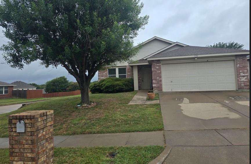 5101 Prestwick Drive Fort Worth, TX 76135 - Photo 1 of 1 front view of house with a yard