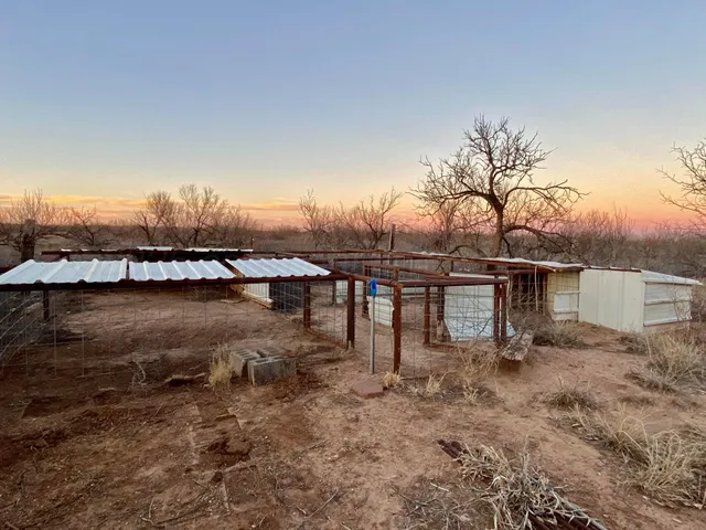 a living room with furniture a dining table and a fireplace
