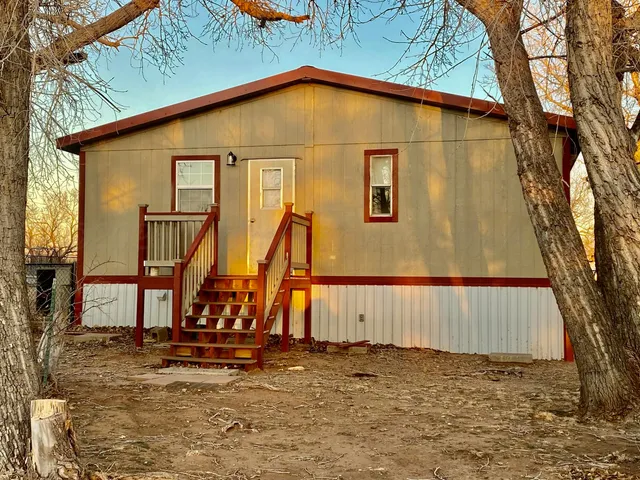 a view of back yard of a house