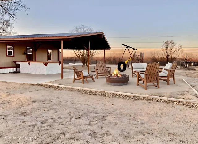 a view of a chairs and table in the terrace