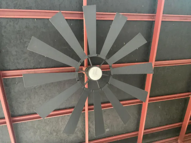 a view of a backyard with table and chairs