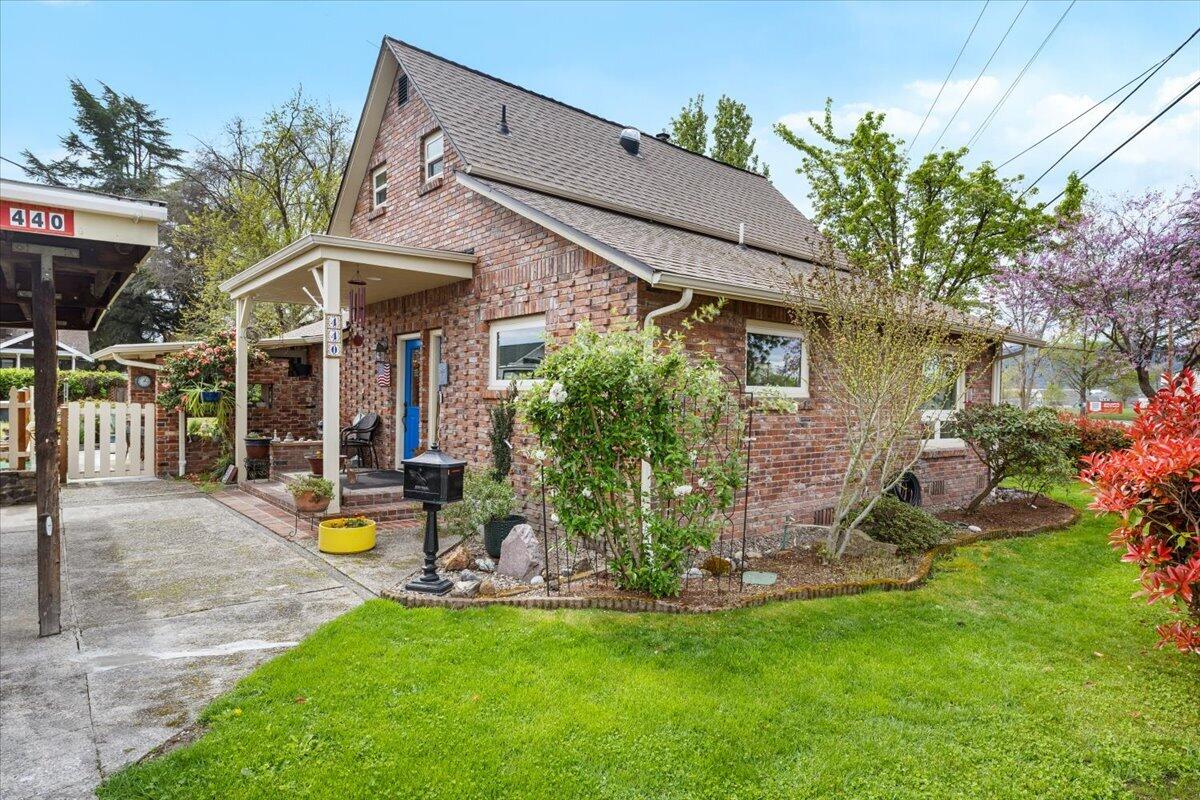 440 Bush Street Central Point, OR 97502 - Photo 1 of 40 a view of a house with a yard porch and sitting area