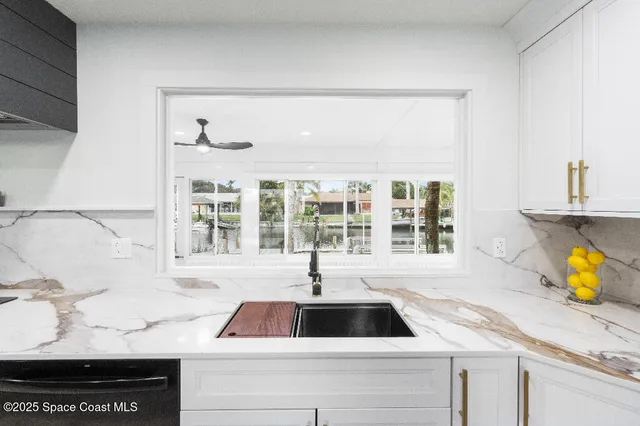 a kitchen with a sink and a window