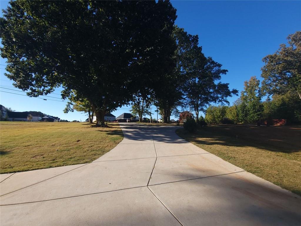 670 Old Alpharetta Road Cumming, GA 30041 - Photo 3 of 13 a view of swimming pool with an outdoor space