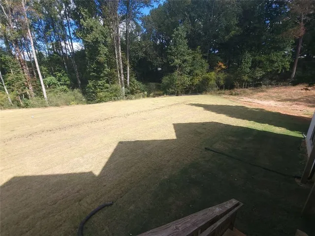 a view of swimming pool with a yard