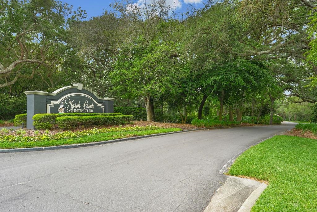 427 Marsh Point Circle St. Augustine, FL 32080 - Photo 4 of 25 a view of a garden with large trees