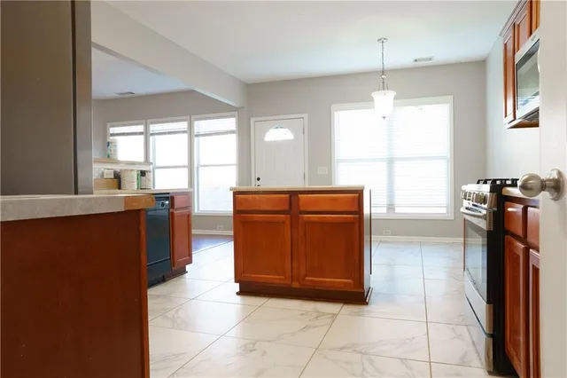 a view of a room with wooden floor and white walls