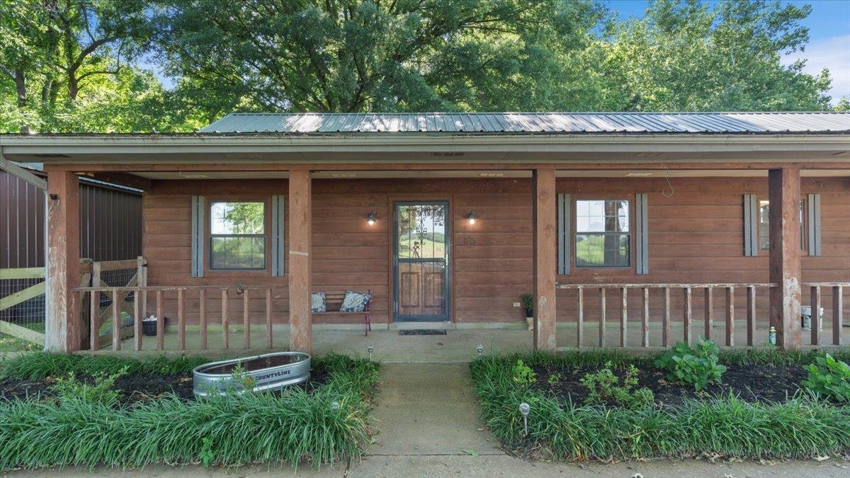 1586 Pickens Store Road Mason, TN 38049 - Photo 3 of 23 a front view of a house with a porch