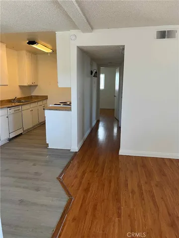 a kitchen with stainless steel appliances granite countertop a stove and a sink