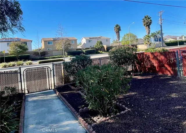 a view of a backyard with sitting area