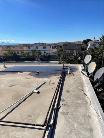 a view of swimming pool and lounge chairs
