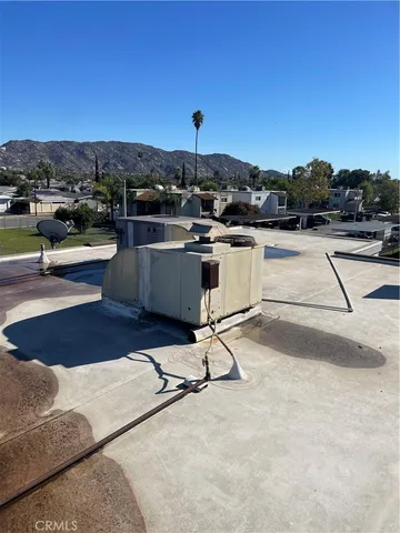 a view of balcony with furniture