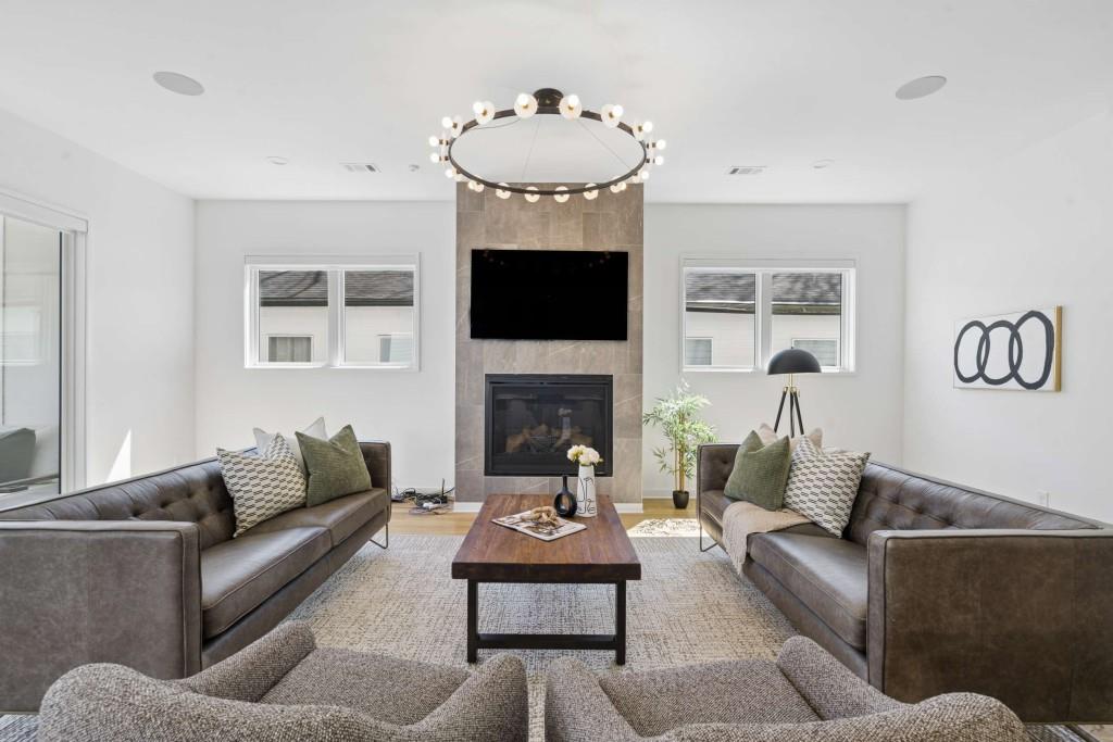 32 Walthall Street Northeast, Unit A Atlanta, GA 30307 - Photo 11 of 39 a living room with furniture and a fireplace
