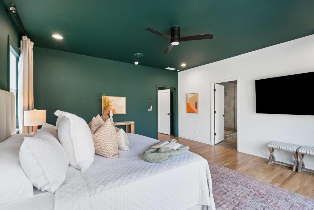 32 Walthall Street Northeast, Unit A Atlanta, GA 30307 - Photo 18 of 39 a bedroom with a bed and a flat screen tv