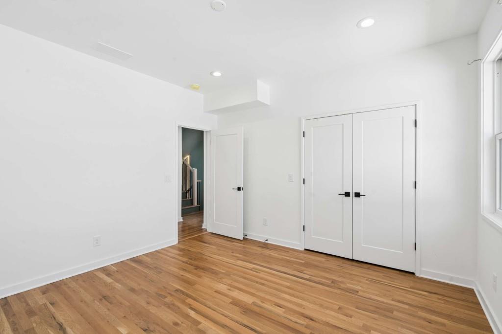 32 Walthall Street Northeast, Unit A Atlanta, GA 30307 - Photo 26 of 39 a view of an empty room with wooden floor