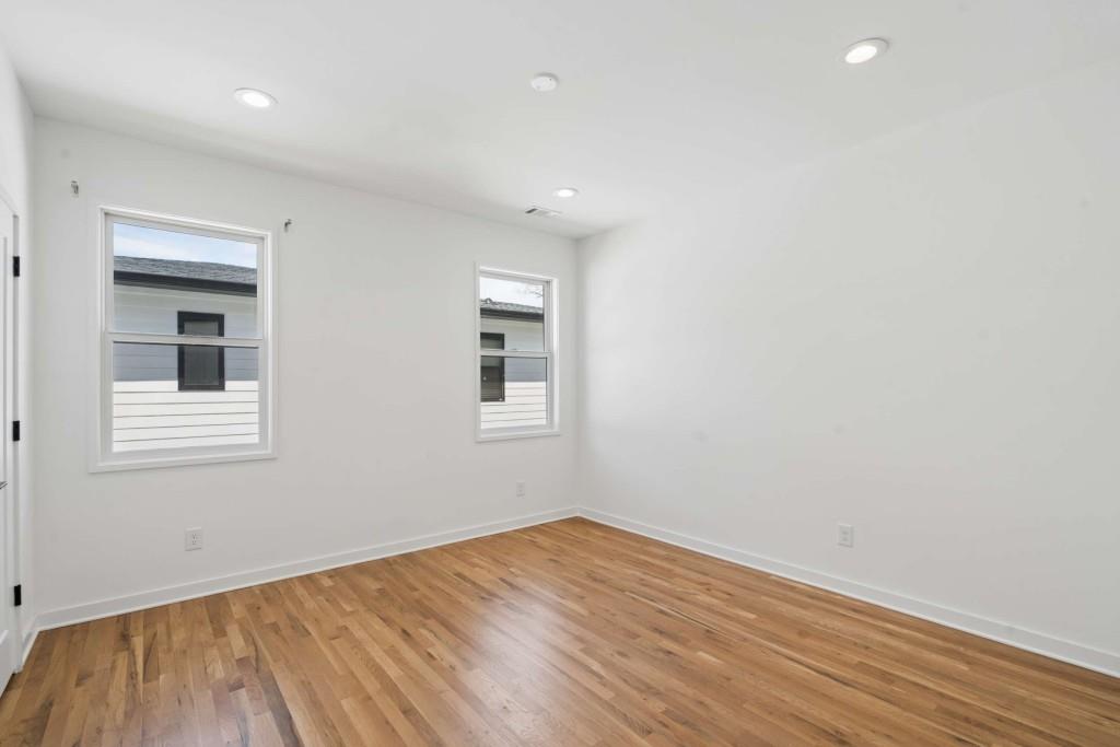 32 Walthall Street Northeast, Unit A Atlanta, GA 30307 - Photo 27 of 39 a view of empty room with wooden floor and fan