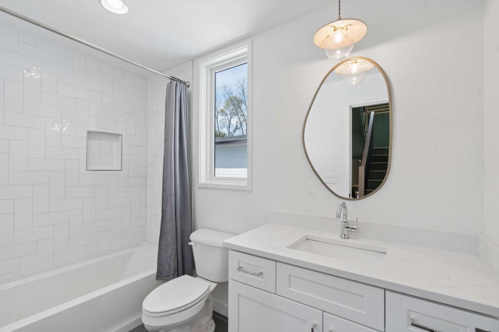 32 Walthall Street Northeast, Unit A Atlanta, GA 30307 - Photo 28 of 39 a bathroom with a sink a toilet and a mirror