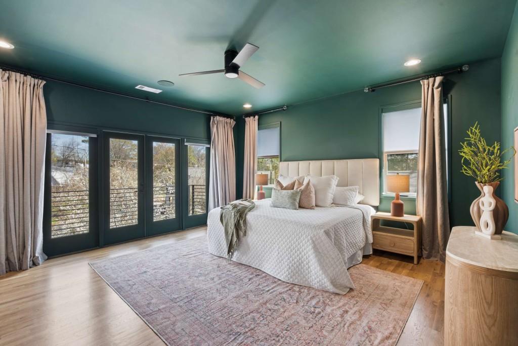 32 Walthall Street Northeast, Unit A Atlanta, GA 30307 - Photo 5 of 39 a spacious bedroom with a large bed and a large window