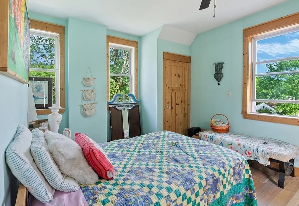 1277 Coosie Branch Road Cornersville, TN 37047 - Photo 18 of 47 a bedroom with a bed and wooden floor
