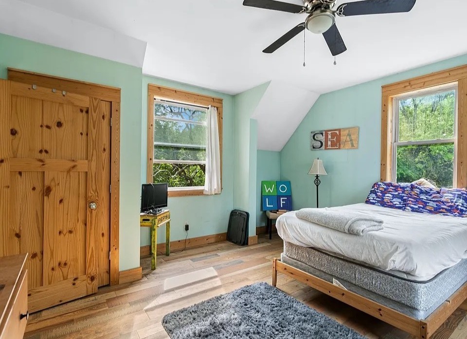 1277 Coosie Branch Road Cornersville, TN 37047 - Photo 20 of 47 a bedroom with a bed and wooden floor