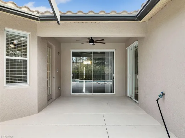 a view of an empty room with a windows