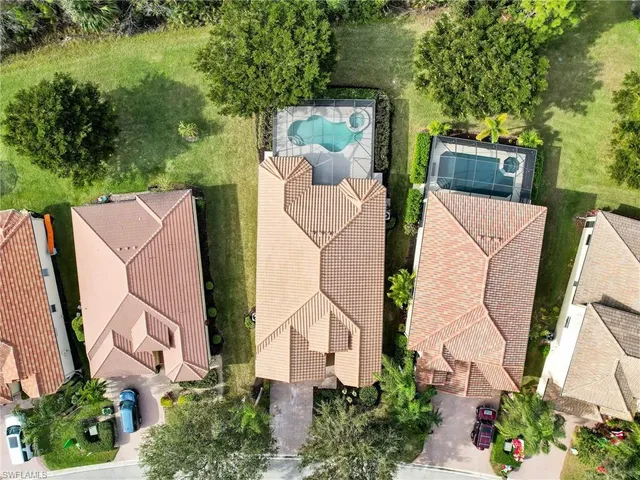 an aerial view of a house with outdoor space and street view