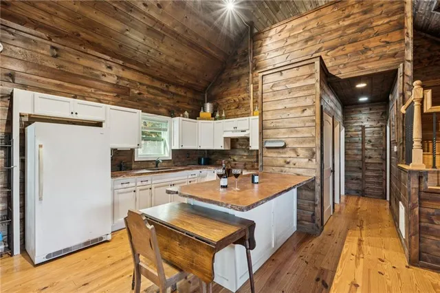a kitchen with cabinets appliances and a sink