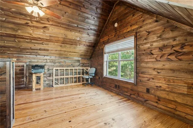 a bathroom with a sink toilet a mirror and shower