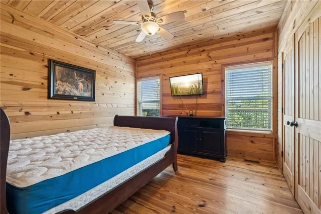 a view of a balcony with wooden floor and outdoor seating