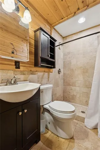 a view of dirt field with a tree