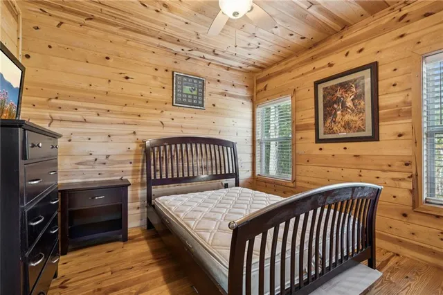 an aerial view of a house with a yard and lake view
