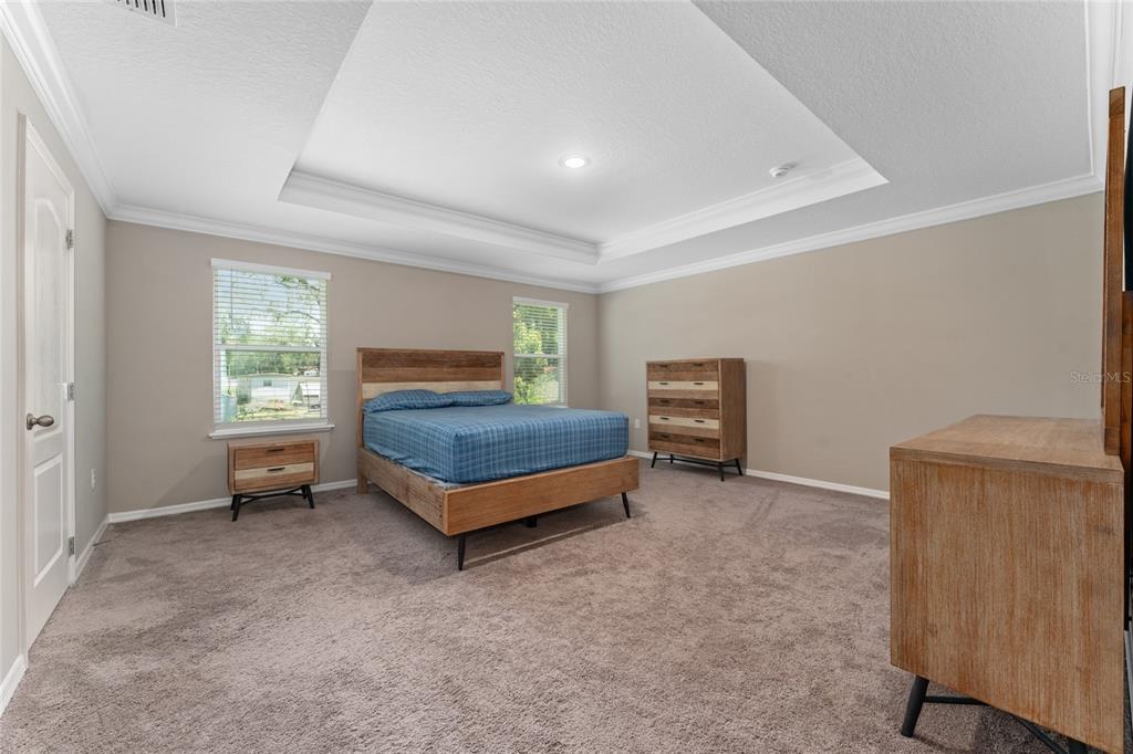 4331 Wayne Road Fruitland Park, FL 34731 - Photo 32 of 46 a bedroom with a bed and a window