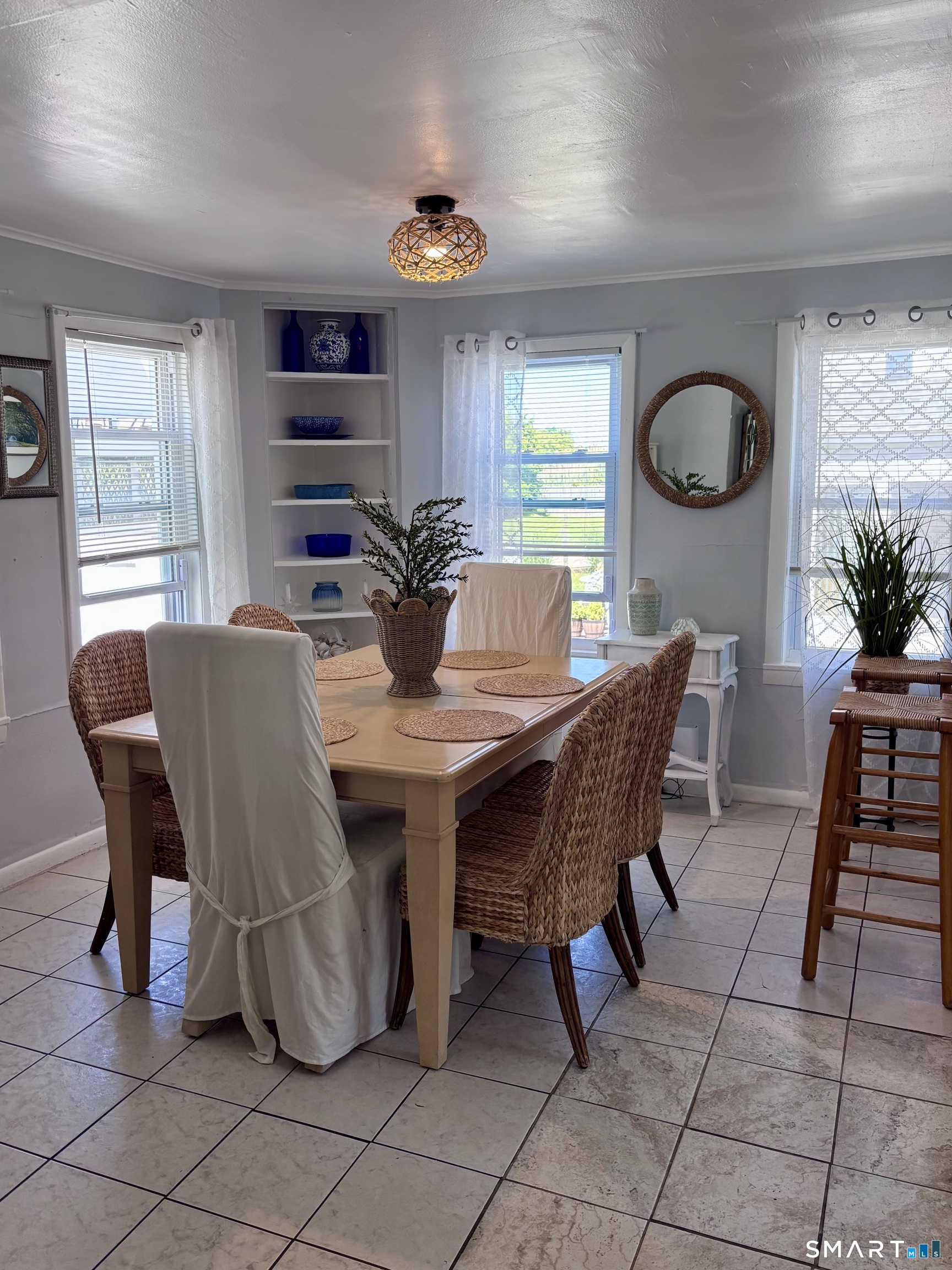 918 Fairfield Beach Road Fairfield, CT 06824 - Photo 7 of 10 a view of a dining room with furniture and window