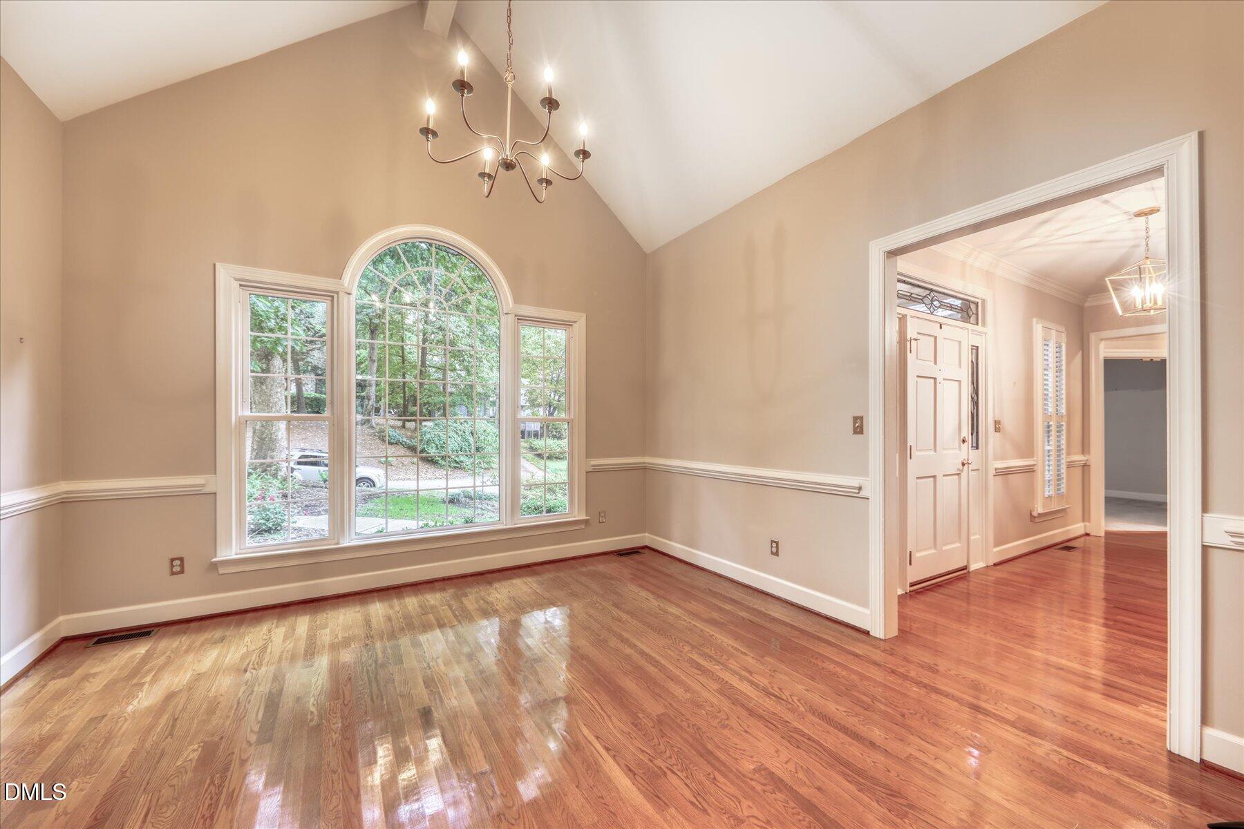 1904 Merion Place Raleigh, NC 27615 - Photo 14 of 43 Tall cathedral ceilings and beautiful floors in separate dining room.