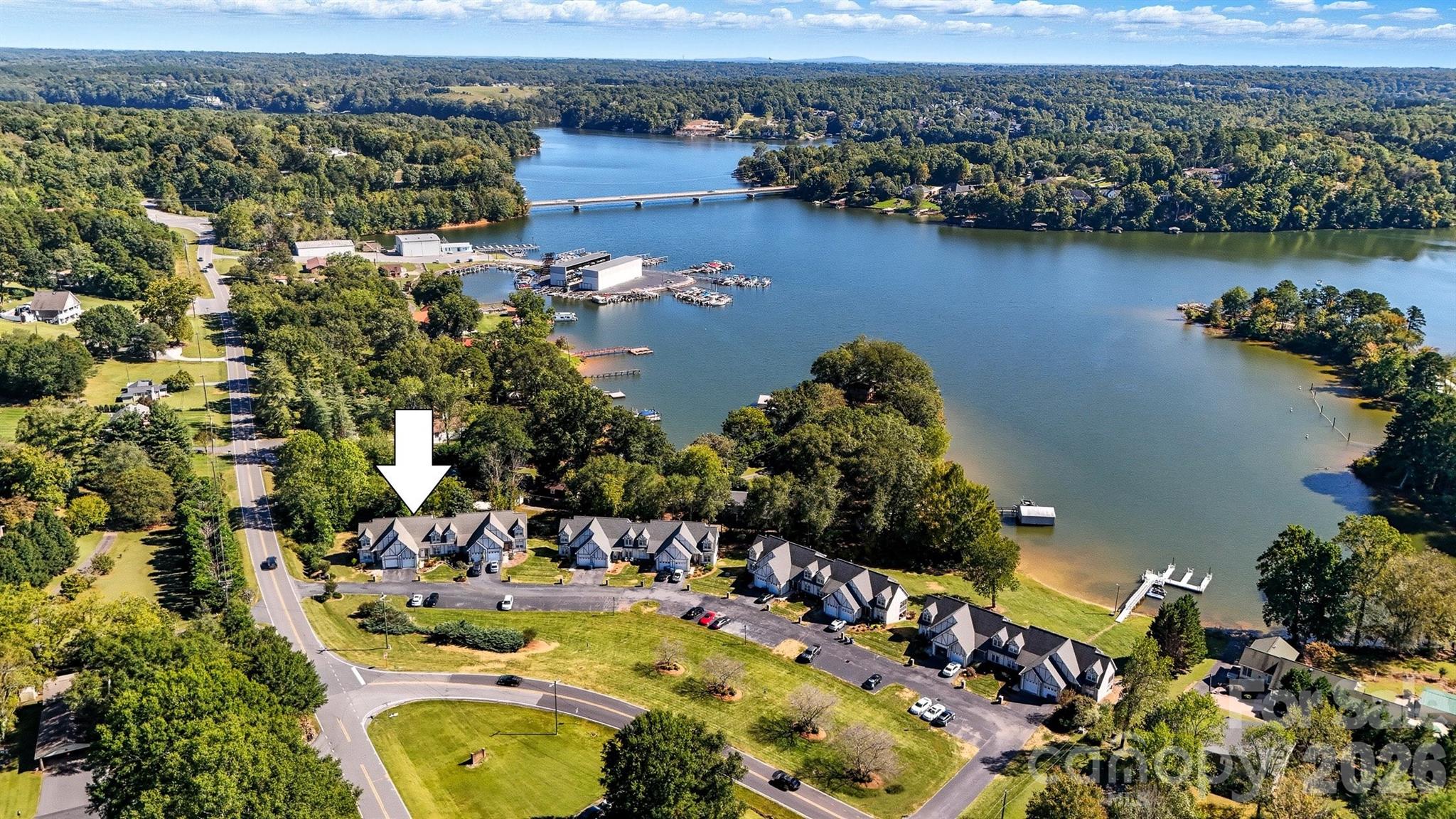 an aerial view of a house with a lake view