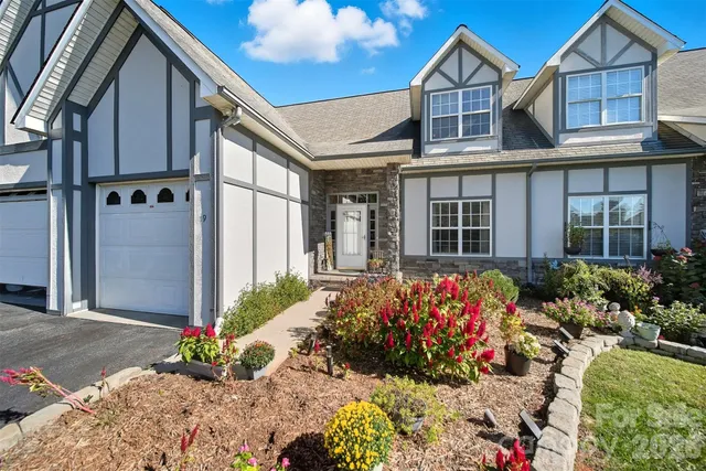 a living room with furniture fireplace and flat screen tv