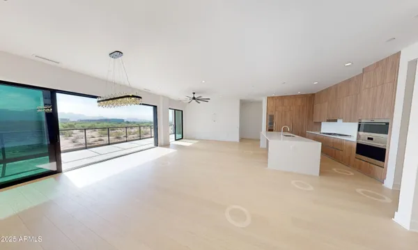 a view of a kitchen with a sink and cabinets