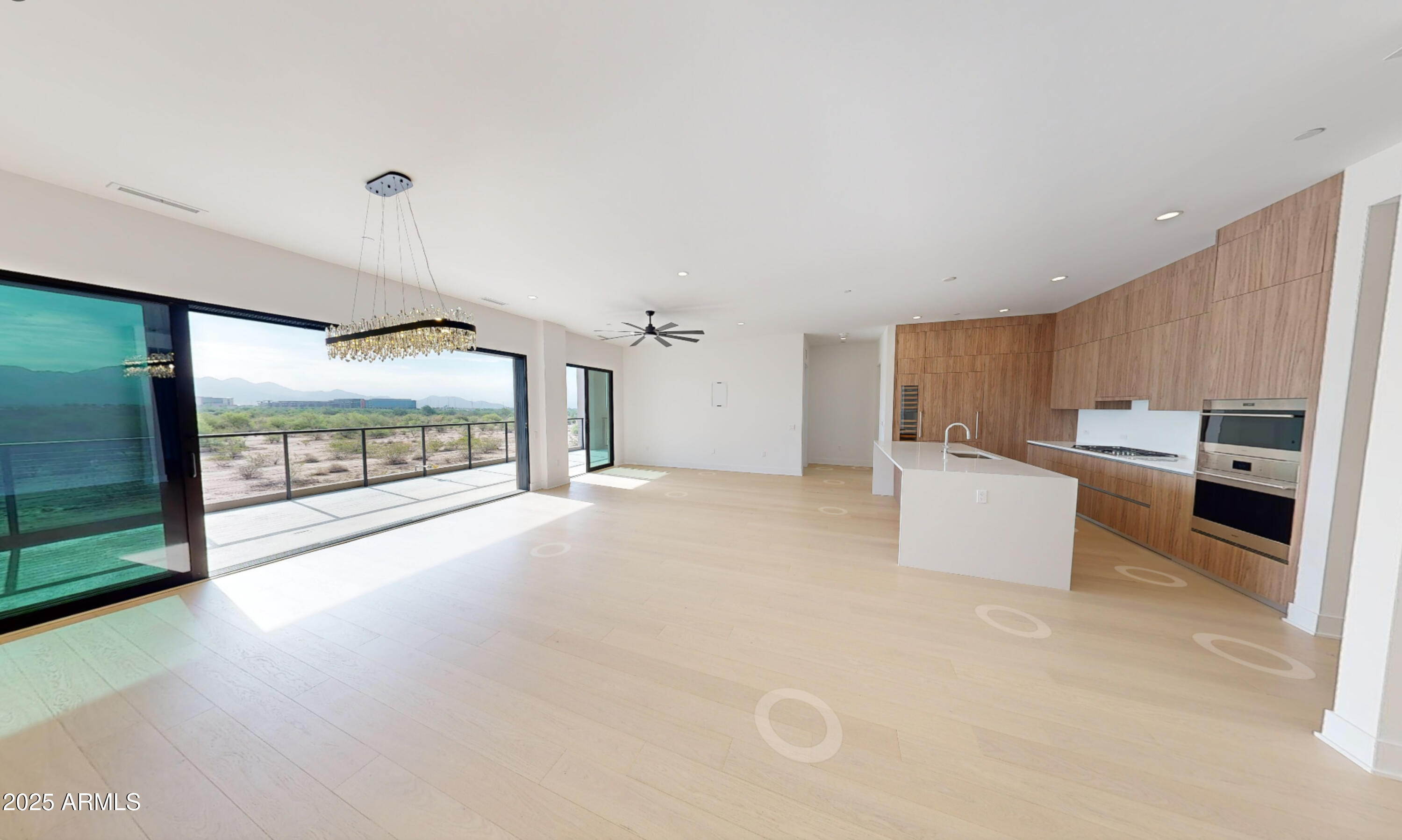 a view of a kitchen with a sink and cabinets