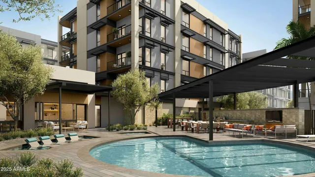 a view of a building with sitting area and swimming pool