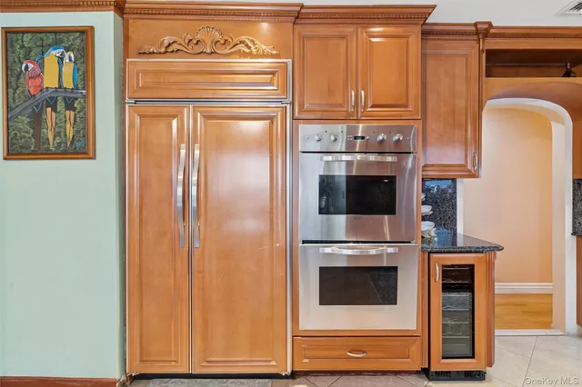 a view of washer and dryer with kitchen in the background