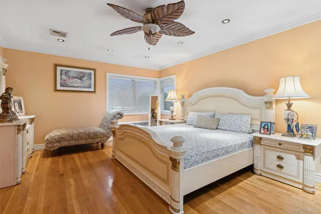 a bedroom with a bed and a lamp